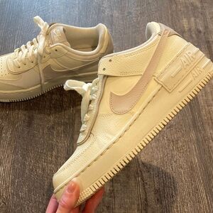 Women’s Nike Air Force 1 Low-Top Sneakers in Cream and White